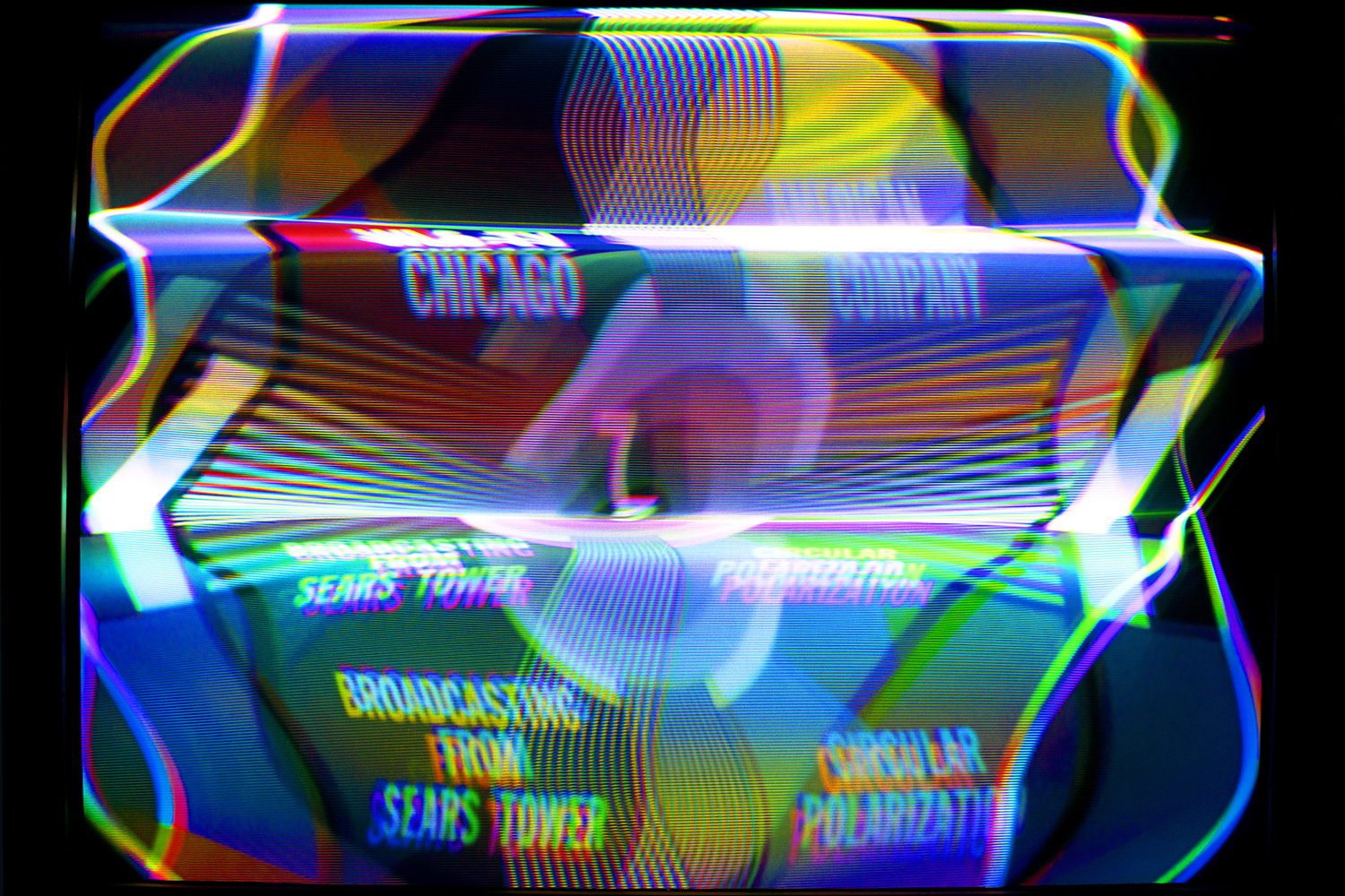 Photo of a WLS-TV test card heavily manipulated electromagnetically through the CRT Flux Phaser.