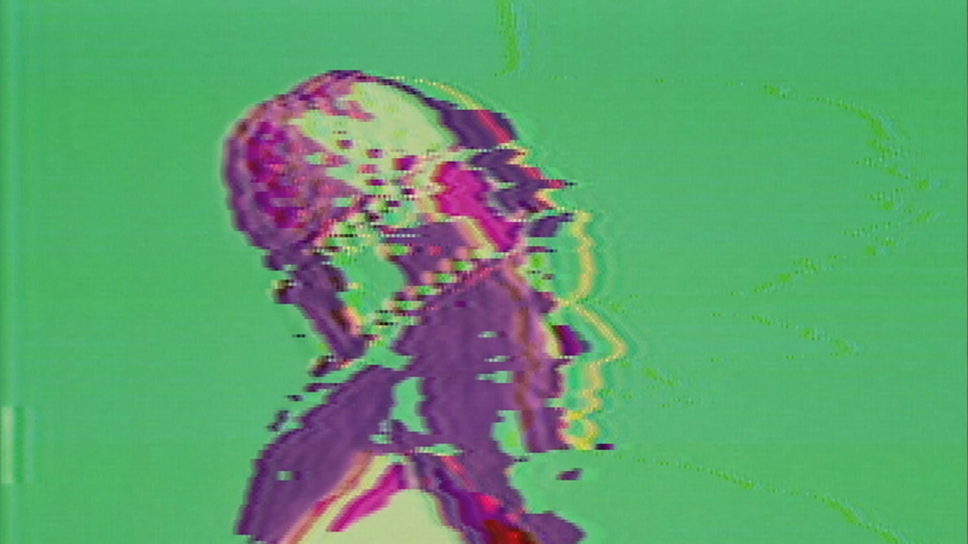 Monica Panzarino from the shoulder's up facing the right wearing a recreation of Dan Sandin's hat tall hat from his 1973 'Romp Through the IP' video, processed on the Sandin Image Processor to have bright colors and broken imagery.