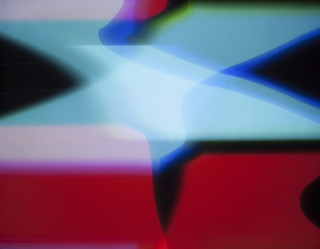 Visuals generated with the RGB.VGA.VOLT video synthesizer; two large shapes made of red and cyan cross in the screen, forming an X.